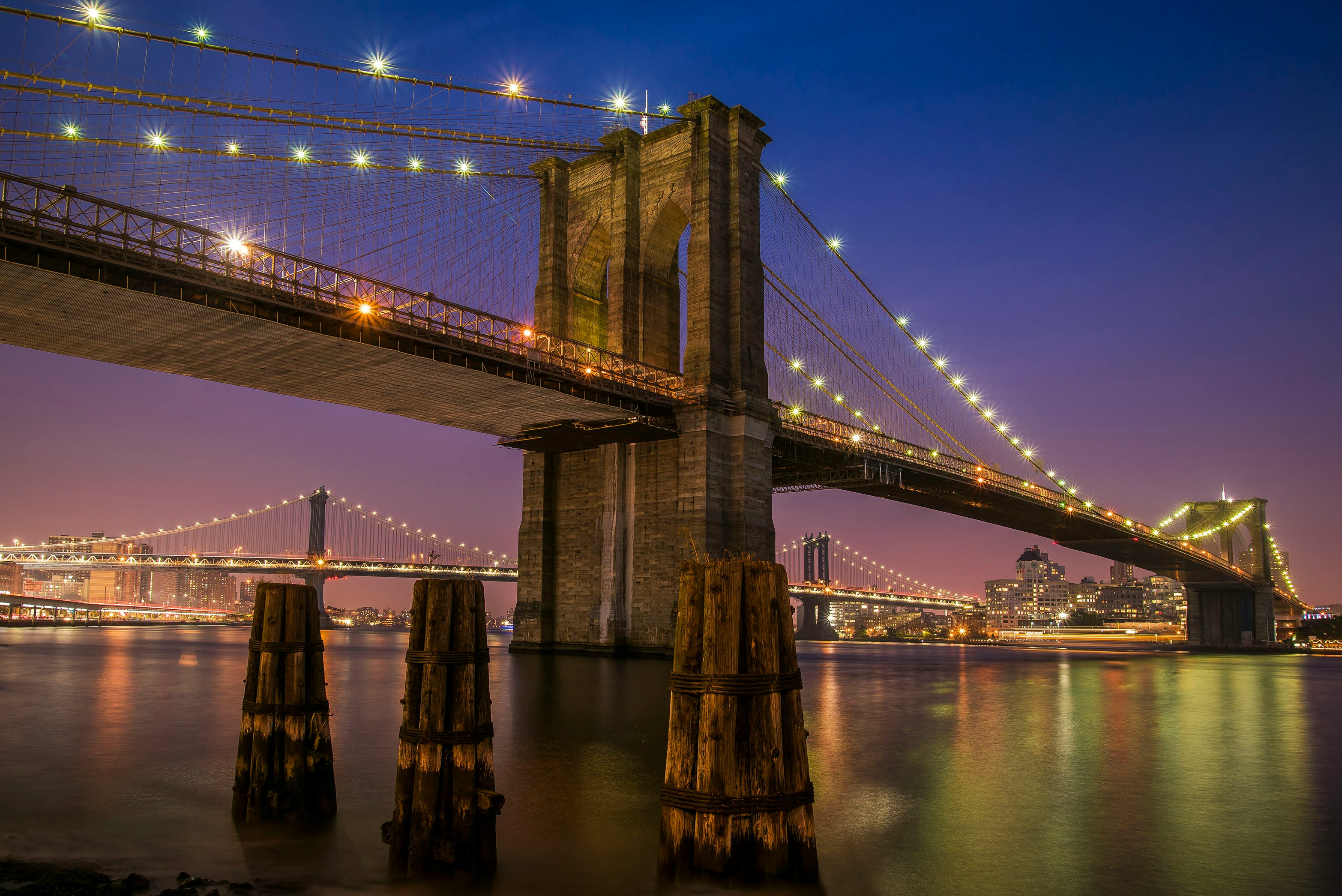 Brooklyn bridge with lights at night time